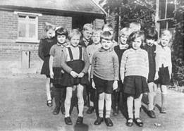 A group of children standing together

Description automatically generated